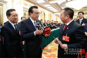 為中國制造“加油”  總理手中的中國紅-東風天龍旗艦